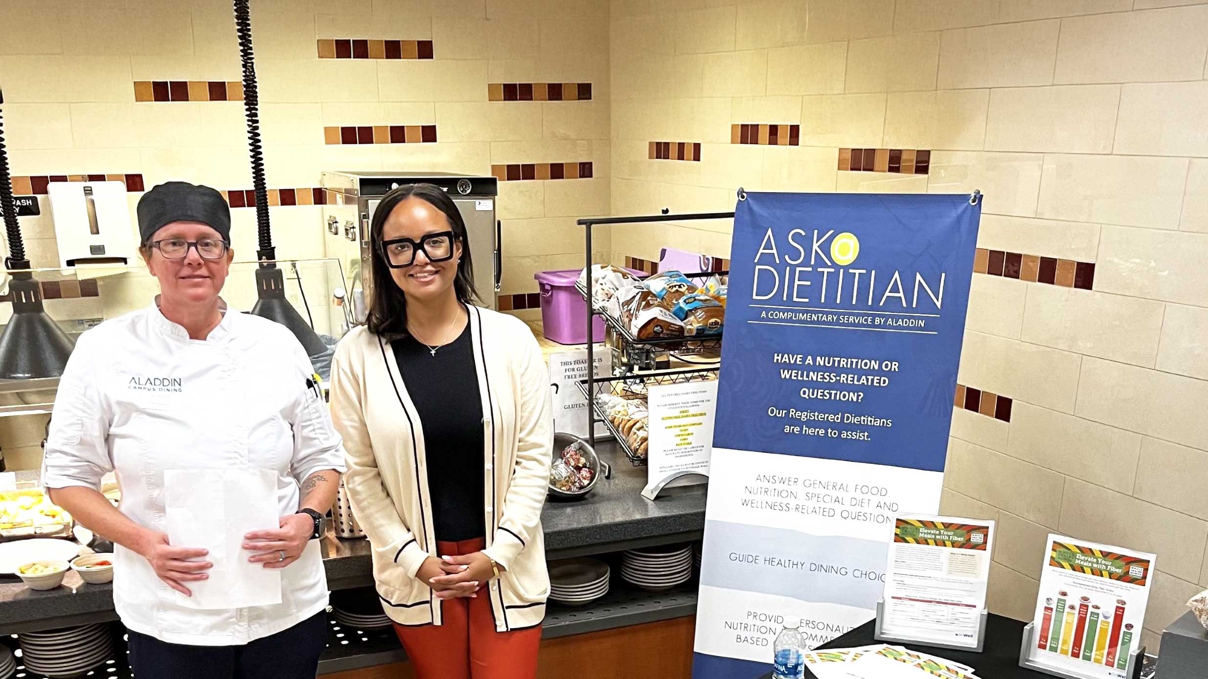 Dietitian and Chef smiling in cafeteria